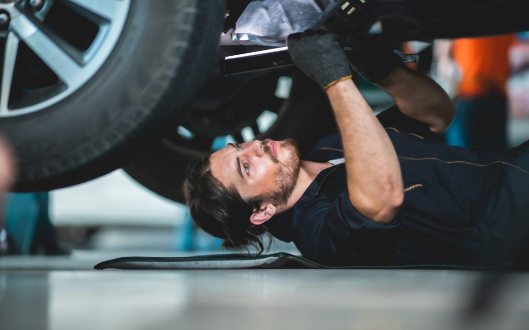 "Technician inspecting drivetrain components for differential replacement needs"